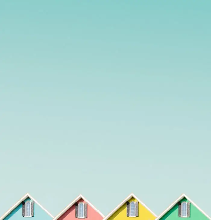 our-services-3 Aesthetic view of vibrant house roofs under a clear turquoise sky in Buffalo, NY.
